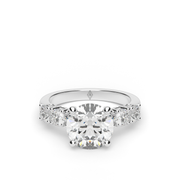 White Gold Round Shape Diamond Side Stone Engagement Ring With Prong Setting